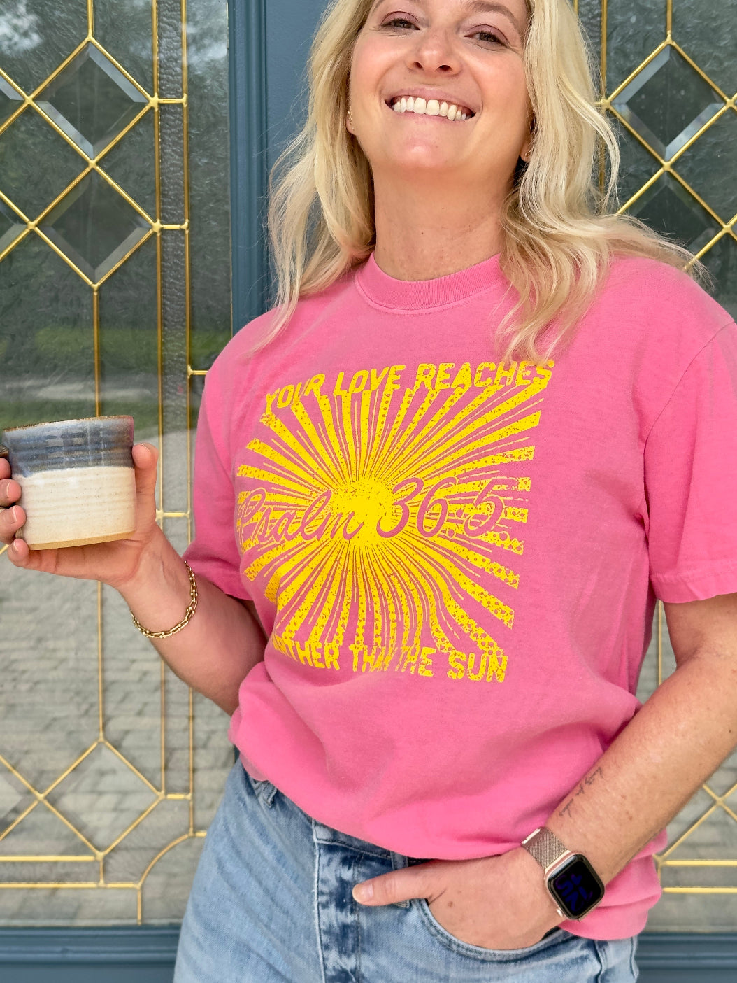 Woman wearing Farther than the Sun Psalm 36:5 Christian t-shirt in Comfort Colors Crunchberry