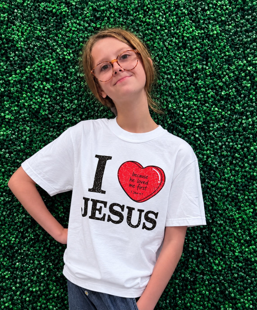 Girl wearing I Love Jesus 1 John 4:9 Christian t-shirt on white Comfort Colors tee