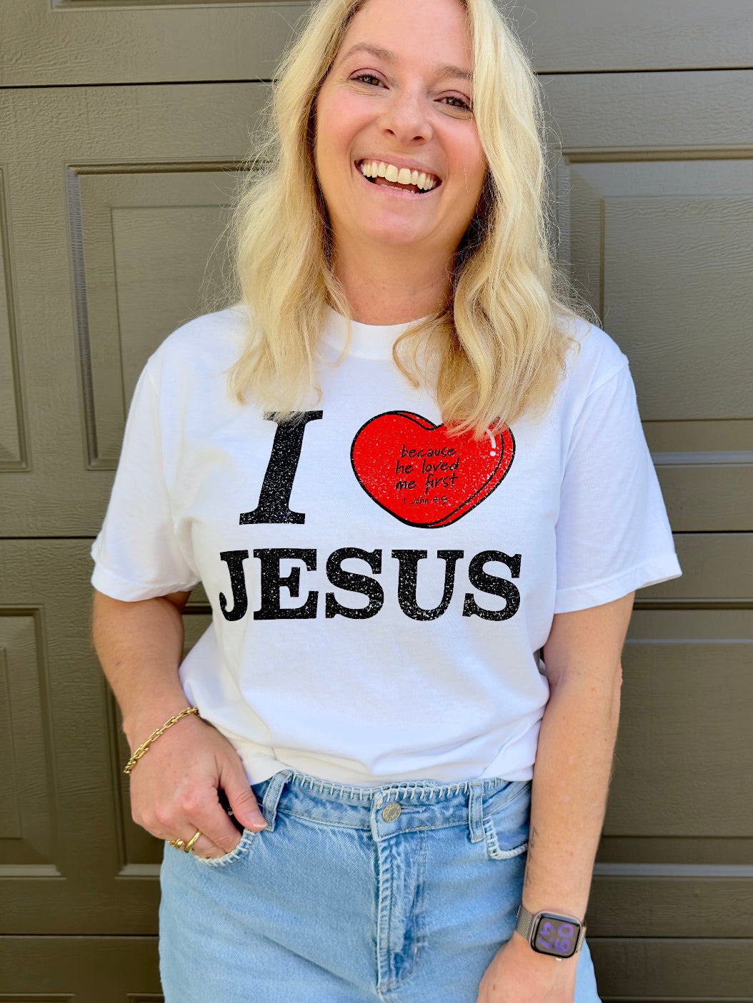 Woman wearing I Love Jesus 1 John 4:9 Christian t-shirt on white Comfort Colors tee