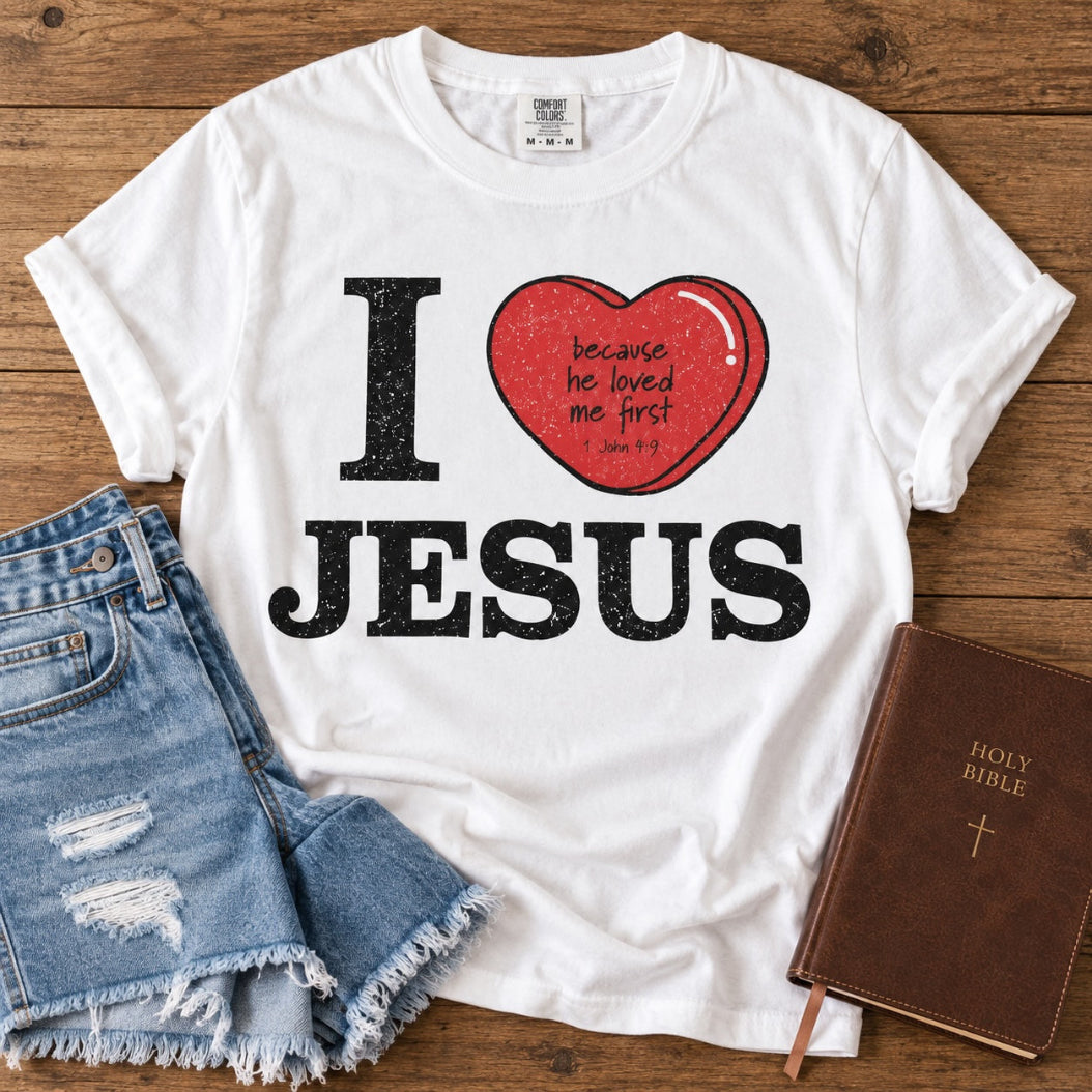I Love Jesus Christian t-shirt styled with denim shorts and Bible on rustic wood