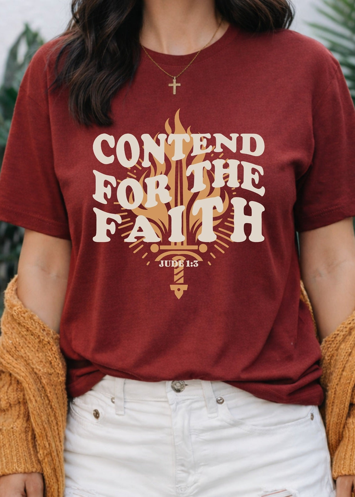 Second Born Art Contend for the Faith Flame Christian t-shirt shown on female model in brick red