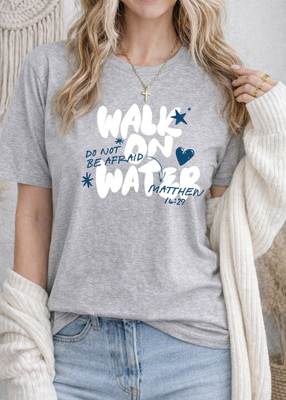 Second Born Art Walk on Water Do Not Be Afraid Christian t-shirt shown on female model in athletic heather
