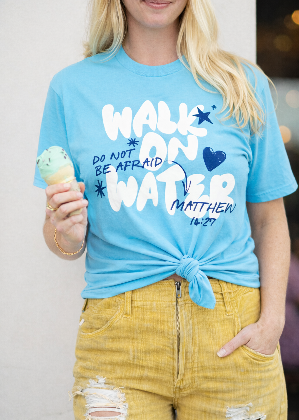 Second Born Art Walk on Water Do Not Be Afraid Christian t-shirt shown on female model in pacific blue